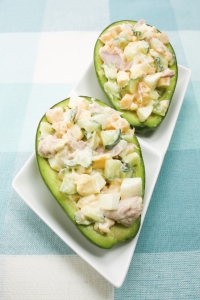 Avocado stuffed with tuna, cucumbers, eggs, cheese and mayonnaise